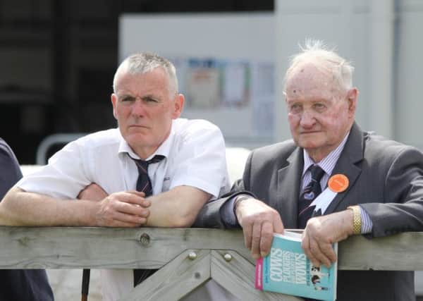 Keeping an eye on the British Blue judging at Balmoral Show are Basil Dougherty, Kircubbin; and Jonny Young, Banbridge. Picture: Julie Hazelton
