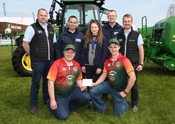 Co Tyrone members Adam Wilson and Craig Burrows, both from Cappagh YFC, with YFCU president Zita McNaugher and representatives from sponsor Johnston Gilpin, and HSENI