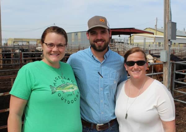 Dr Jenny Jennings (right), a research scientist at Texas A & M 
University's Beef Cattle Reserach Lot near Amarillo in Texas with 
colleagues Caleb and Cathy Lockard.