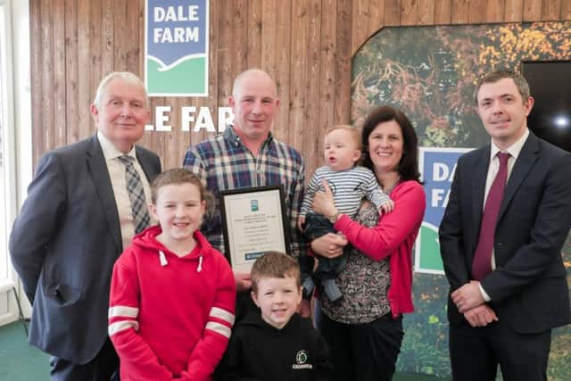 Pictured are Alan and Lorraine Johnston and family from Newtownhamilton, receiving runner up in the up to 7,000 litres category