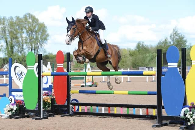 Lewis Trenier riding Trickin Around, winners of the 1.30m SJI. Pictures: Victoria O'Connor