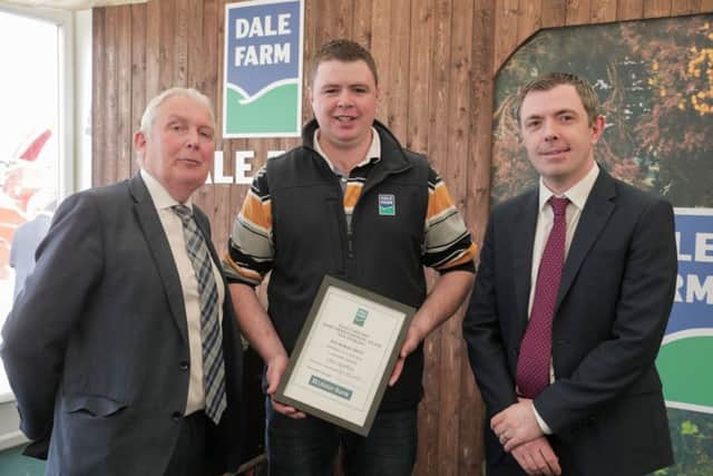 Pictured is Chris Hamilton, from Carrowdore, receiving the award for Dairy Herd Fertility New Entrant. Presenting the award are John Dunlop, Chairman, Dale Farm Group and Stephen Hughes, Ulster Bank
