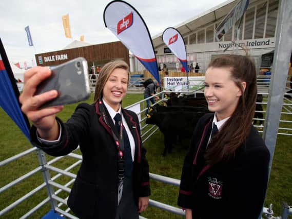 Samantha Todd and Emma Turner from Wallace High School, Lisburn who are finalists in the ABP Angus Youth Challenge pictured on the cattle lawn at Balmoral Show on Friday. Picture: Steven McAuley/McAuley Multimedia