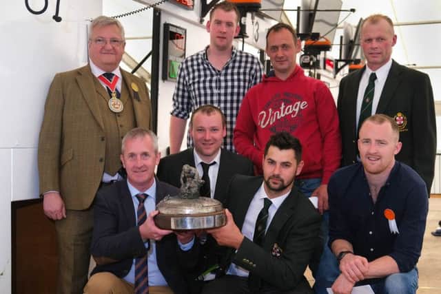 Paul Redmond, Zoetis, front left presents a trophy to Jack Robinson, Claudy winner of the Zoetis sponsored Royal Ulster National Sheep Shearing Championship Final at Balmoral Show. Also included are middle from left: Ian Montgomery, Ballymena, 3rd and Tom Perry, Strabane, 2nd. Back from left: Mark Johnston, Master of Worshipful Company of Woolmen; Jonathan McKelvey, Castlederg, 5th; James McAuley, Ballynure, 4th and William Jones, Templepatrick, 6th. Photograph: Columba O'Hare/ Newry.ie