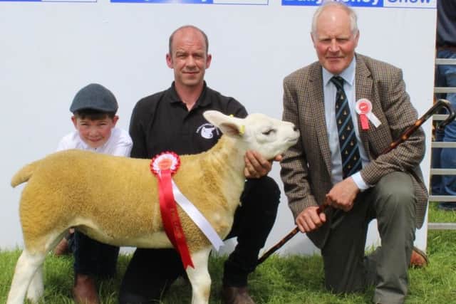 Left to right: Sam Harry McNeilly, Ballyclare, his father Stephen and Sheep Inter Breed Judge Andrew Warnock with the Texel and Inter-Breed Ewe Lamb Champion at Ballymoeny Show 2019