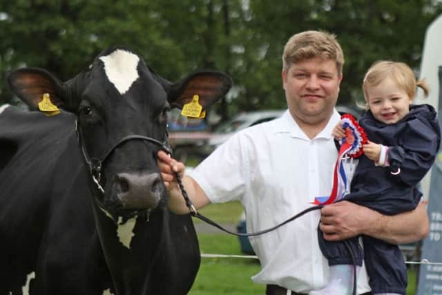 Simon Haffey, and daughter Martha, Portadown, with their Holstein and interbreed dairy champion at 107th Lurgan Show. Picture: Julie Hazelton
