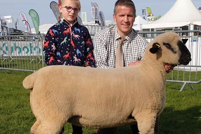 Stirling and Graham Manson with first placed shearling ewe Balmoral