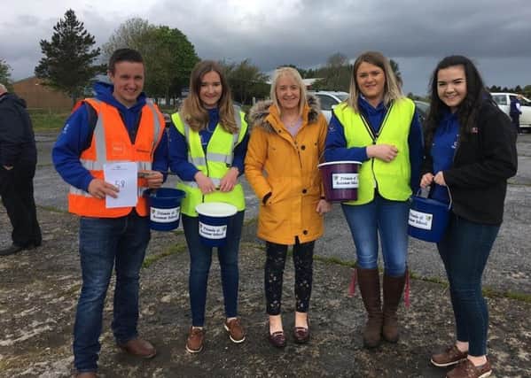 From left, Matthew Gault (club leader), Zara Fulton secretary, Mrs Clements (principal of Rossmar School), Laura Fulton (assistant treasurer) and Claire Young (PRO) pictured at the beginning of Dungiven's tractor run in aid of Rossmar School