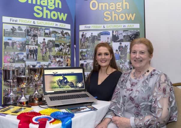Sinead Harkin and Anne Mc Dermott look over Tyrone Farming Society's all-new Website including online entries and results system.TFS-01