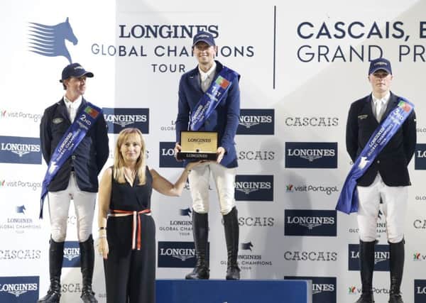 Left to right, Ben Maher (Great Britain), Martin Fuchs (Switzerland) and Michael Duffy (Ireland) stand on the podium following the Longines Global Champions Tour Grand Prix at Estoril in Portugal (Picture: Stefano Grasso)