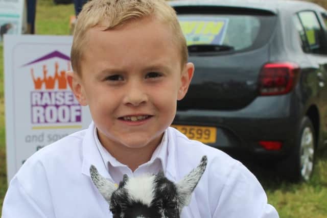Reece Johnston, from Newtownhamilton, with his pigmy goat kid - 
Pippa - at this year's Newry Show