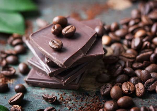 A generic photo of dark chocolate with cocoa beans. See PA Feature TOPICAL Health Brain Foods. Picture credit should read: PA Photo/thinkstockphotos. WARNING: This picture must only be used to accompany PA Feature TOPICAL Health Brain Foods.