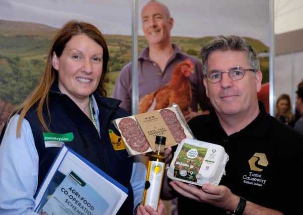 Mandina Fulton, left, Countryside Services discusses the Agri-Food Co-Operation Scheme with Fergus Wallace from Taste Causeway. Photograph: Columba O'Hare/ Newry.ie