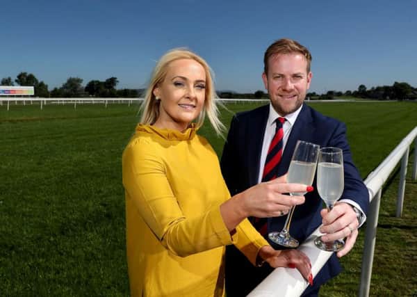 Pictured celebrating the partnership is (left to right) Emma Meehan, chief executive of Down Royal Racecourse and Stuart Carson, director of sales and marketing at Rainbow Communications