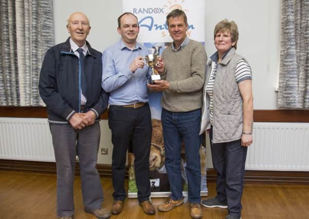 Pictured are Randox Antrim Show's Chairman Fred Duncan, David Crawford, Graham Seymour and Jane Kidd with a new cup for best exhibitor in the Vegetable section. The Jim McKay Trophy has been presented on behalf of the late Jim McKay; a steward and exhibitor in the Horticultural section for many years. Photo: Andrew Hyde.