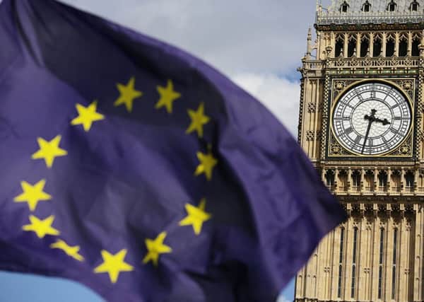 A European Union flag in front of Big Ben, London. Pic: Daniel Leal-Olivas/PA Wire