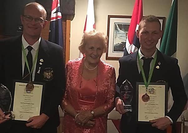 James Coulter (left) and Andrew Gill (right) pictured with Anna May McHugh, Honorary Board Member of the World Ploughing Organisation, at the World Ploughing Championship awards evening in Baudette, Minnesota, USA.  Andrew, who is a member of Listooder Ploughing Society, was bronze medalist winner in the conventional class on day one (stubble) and James, a member of Hillsborough Ploughing Society was the bronze medalist in the reversible class on day two (grassland).  Both these young ploughmen, were awarded the Best Newcomer Awards in Conventional and Reversible.  Andrew was fourth overall and James came fifth overall.  This is Andrew and James first time attending the World Ploughing Championships and they will be competing again on Saturday, September 7, at the Northern Ireland International Ploughing Championships, when they will attempt to qualify for next year's World match in Russia