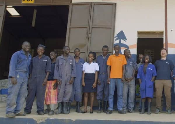 Pictured is the team at Devenishs model pig farm and specialized feed mill in Hoima. The company now employs over 25 people in the region.