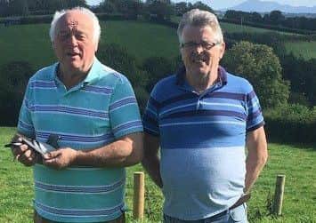 Pictured  -  Gerald Delaney with good friend Tommy Knox proudly displaying their winner 1st Sect G Five Bird Championship