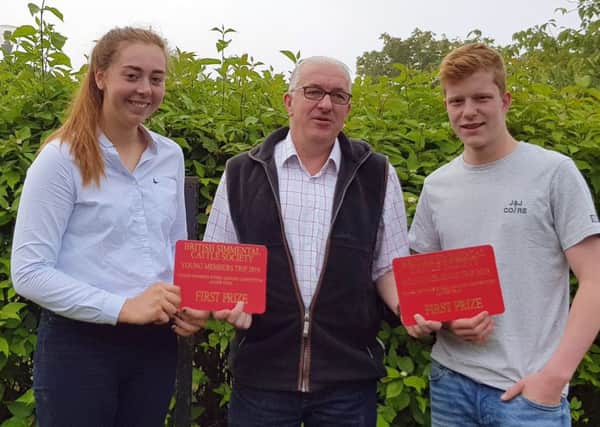 First prize junior team members Cara Moore, Beragh, and Jonny McCammond, Randalstown, were congratulated by Neil Shand, chief executive, British Simmental Cattle Society.
