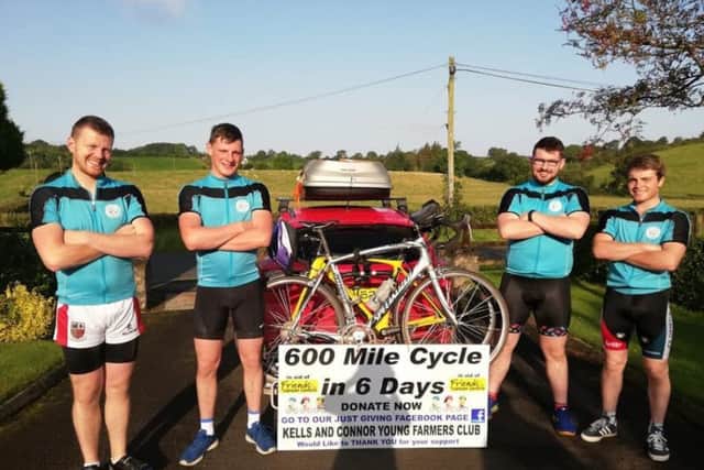 Peter McWhirter, James Fullerton, Houston Bonnar and Andrew White and their poster they got made by Graphic Attacks to have on the back of the car throughout the cycle to grab peoples' attention