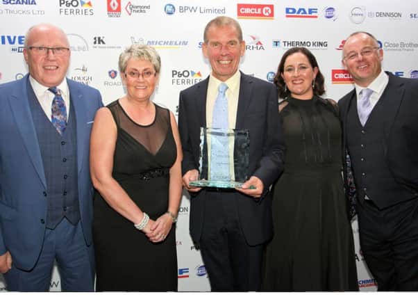Isuzu NI Regional Manager Alistair Kerr (centre) and Isuzu NI dealer team with the 2019 POTY award.