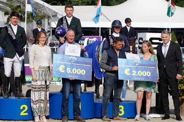 Jason Foley (centre) and Mikey Pender (left) stand on the podium after winning Gold and Silver medals at the FEI WBFSH Show Jumping World Breeding Championship for Young Horses in Lanaken