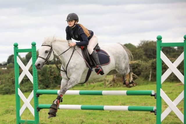 Kyla Thompson and Molly on their way to winning the Pony SJ Novice and Open competitions