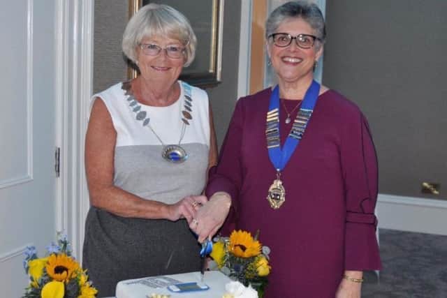 Federation Chairman Collette Craig and President of Maghaberry WI Julie Uprichard cut the anniversary cake.
