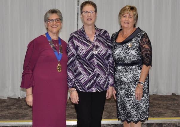 President Julie Uprichard, Irene Culbert, daughter of founding member Mary Lewis, and Vice President Ann Henning at Maghaberry WIs 70th anniversary dinner