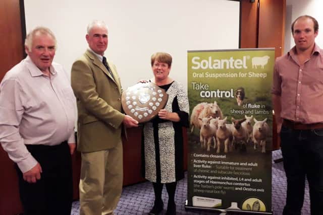 Judge Tim Prichard presents the Large Flock Trophy to The Cowan Family, Drew,Maureen and Stephen