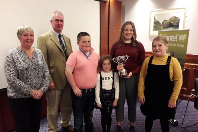 Julia and Tim Prichard present the Female of The Year Trophy to James and Sarah Wilson and Sophie and Charlotte McAllister