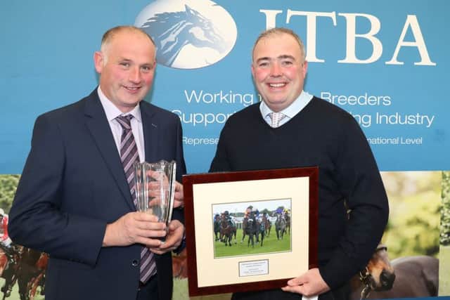 Colin Kennedy receives the leading two year old prize from Coolmore Studs representative Ted Walsh Jnr