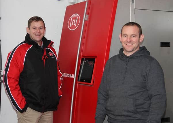 Dean Cashel, Lely Center Eglish, is pictured with Irwin Tinney from St Johnston, Donegal, who is achieving a 305-day average of 8,200 litres at 4.06% fat and 3.61% protein using a Lely Astronaut A4 robot. Picture: Julie Hazelton