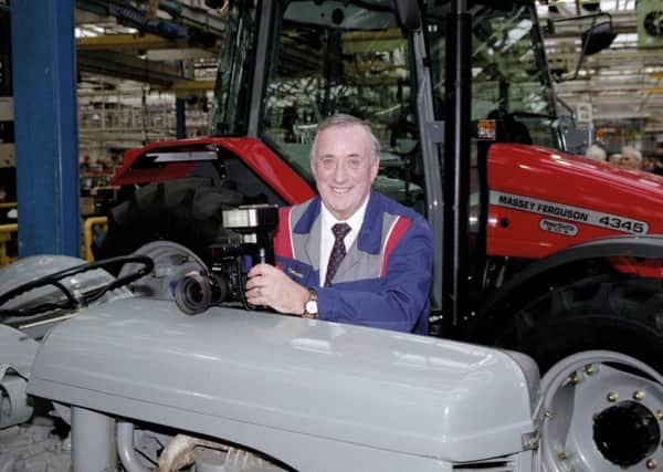 2002 - Ted Everett pictured with the first and last tractors to be built at the Banner Lane plant.