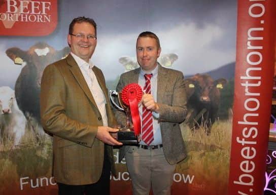Richard Henderson winner of stock bull (small herd) with judge James Porter