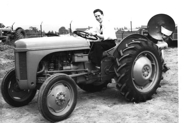 Ted Everett with a TE 20 in an early selfie from the 1950s. This shot was taken when he was experimenting with the camera timer. In this case, he set it to seven seconds to give him time to jump on board the tractor