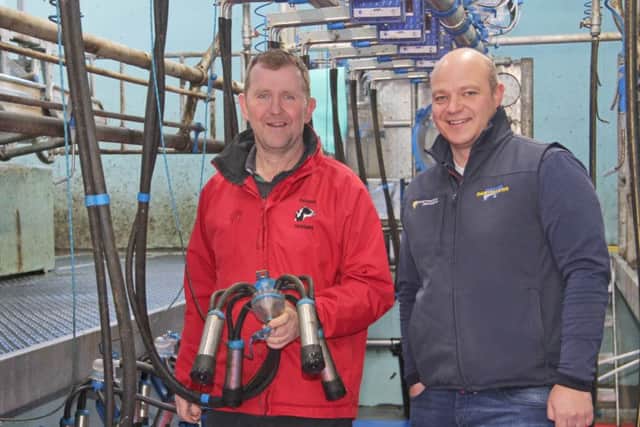 Glarryford dairy farmer Wallace Gregg is pictured with Gavin Connaughty from Cookstown Dairy Services. Picture: Julie Hazelton
