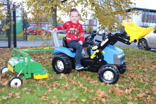 This young customer looks very happy with his purchase