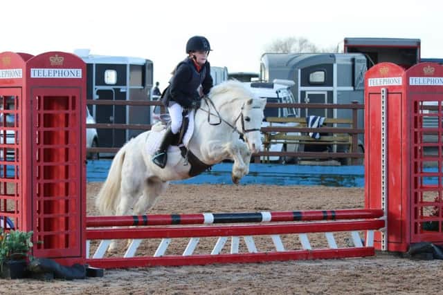 Sophie Burns riding Magical Merlin, winners of the 50cm individual