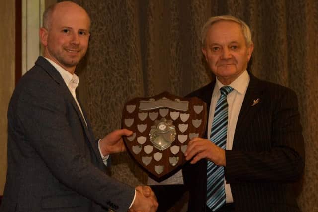 Herbie Crawford collects the Lusby Shield for Show Team of the Year 2019 from Cahir McAuley