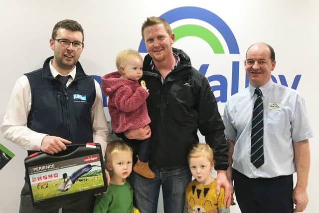 John Graham, Allflex UK presents Colin Hughes and family from Armagh with their Heiniger Xperience Clipper at the recent RUAS Winter Fair. Also pictured is Clifford McCullagh, Fane Valley Stores - Manager Portadown.