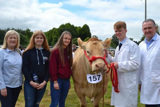 The McCusker family with their cow Isabelle