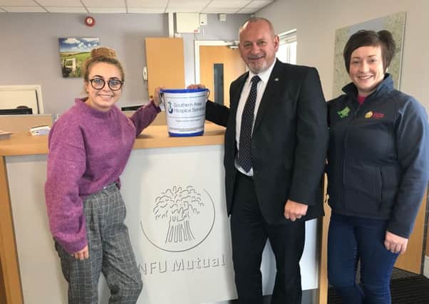 Amy Henshaw, Southern Area Hospice fundraiser, representing the chosen charity and Lawson Burnett NE Armagh UFU group manager and Roberta Simmons, UFU membership development officer, representing the event organisers.