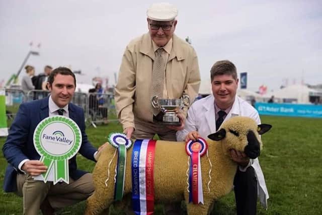 Brian Kennedy with his granda Joe Kennedy and their championship winning ram lamb at Balmoral Show