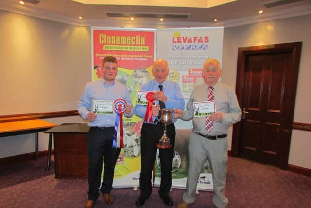 James Barr, Kells, and his nephew, Andrew Barr, receiving the top prize, The Knockavoe Cup,  for The NI Kerry Hill Champion Flock 2015. From judge R McCauley.
