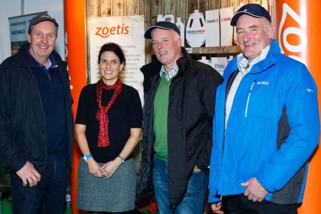 Aurelie Moralis, Zoetis with Tom Montgomery, Killough and Ian and Kenneth Dickson, Downpatrick on the Zoetis stand at the RUAS Winter Fair. Photograph: Columba O'Hare