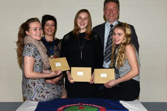 Emma Wallace, Sarah Cunningham and Katie Ramage who took first place 14-16 being congratulated by guest speaker Richard Halleron and Roberta Simmons YFCU president