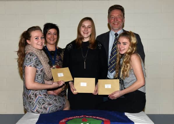 Emma Wallace, Sarah Cunningham and Katie Ramage  who took first place 14-16 being congratulated by guest speaker Richard Halleron and Roberta Simmons YFCU president