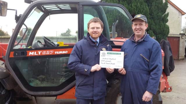David Mawhinney presents Richard Shepherd, Ballyronan, with a Â£100 voucher for Fresh Start cow drink, provided by Premier Nutrition.